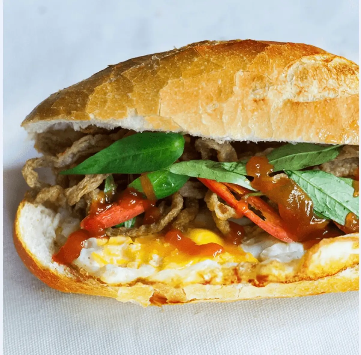 Bánh mì chả cá ốp la - 34.000 ₫ tại Bé Thi - Bánh Mì & Cà Phê - Đường 25A