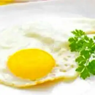 Ốp la thêm - 10.000 ₫ tại Cơm Gà Xối Mỡ Tài Ký - Đường Số 32