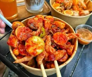  Chân Gà Rút Xương Mix Trúng Gà Non - 99.000 ₫ tại Chân Gà Sốt Thái Đức Em - Đường T6