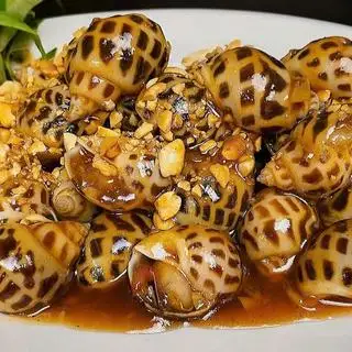 Hình ảnh Ốc hương xào me