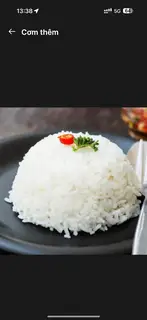Cơm thêm - 10.000 ₫ tại Cơm Tấm Cô Hai Châu - Nơ Trang Long