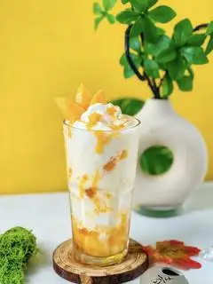 Hình ảnh Trà sữa xoài hoàng kim