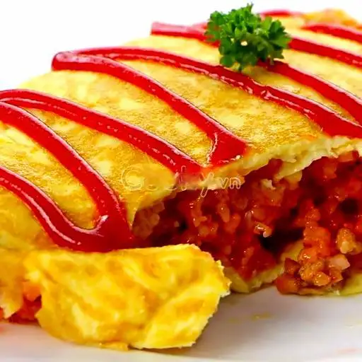 Cơm thịt gà bột cà ri cuộn trứng - 50.000 ₫ tại Cơm Chiên Tá Lả - Bùi Viện