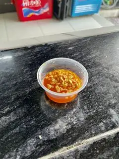 nước xốt mắm tỏi  - 2.000 ₫ tại Hồ Gia - Cơm Gà Xối Mỡ - Hoàng Văn Thụ