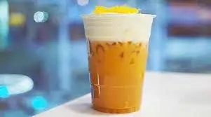 Hình ảnh Lục trà xoài macchiato