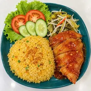 Hình ảnh Cơm má đùi sốt me cay