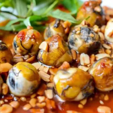 Hình ảnh Cút lộn xào me