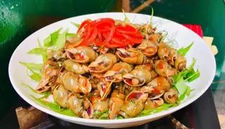 Ốc cà na xào me - 59.000 ₫ tại Ốc Hẻm - Lê Văn Lương