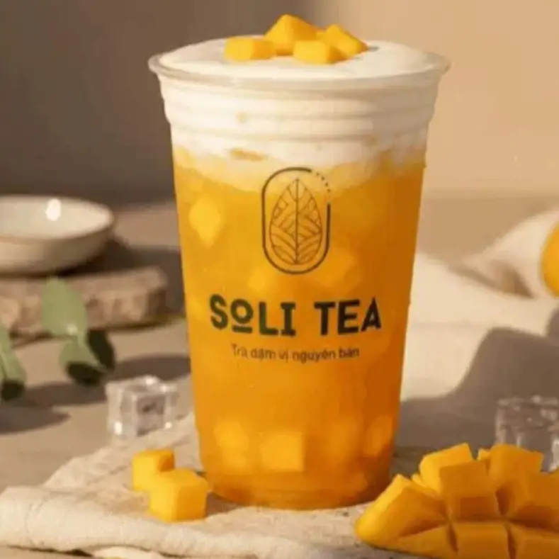 TRÀ XOÀI MACHIATO - 42.000 ₫ tại TIỆM TRÀ SOLI - Trà Sữa Đậm Vị & Trà Trái Cây - Sư Vạn Hạnh 