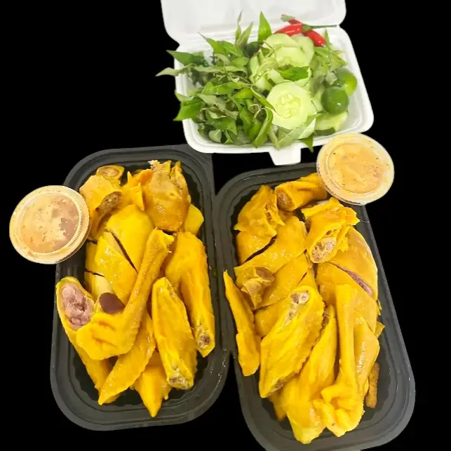 Hình ảnh Nửa con gà ri có đầu, chân + dưa leo, rau răm, nước chấm