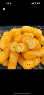 Hình ảnh Tokbokki nhân phô mai hoàng kim lắc phô mai HQ