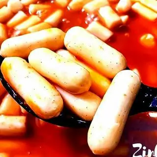 Hình ảnh Tokbokki nhân phô mai sốt mật ong