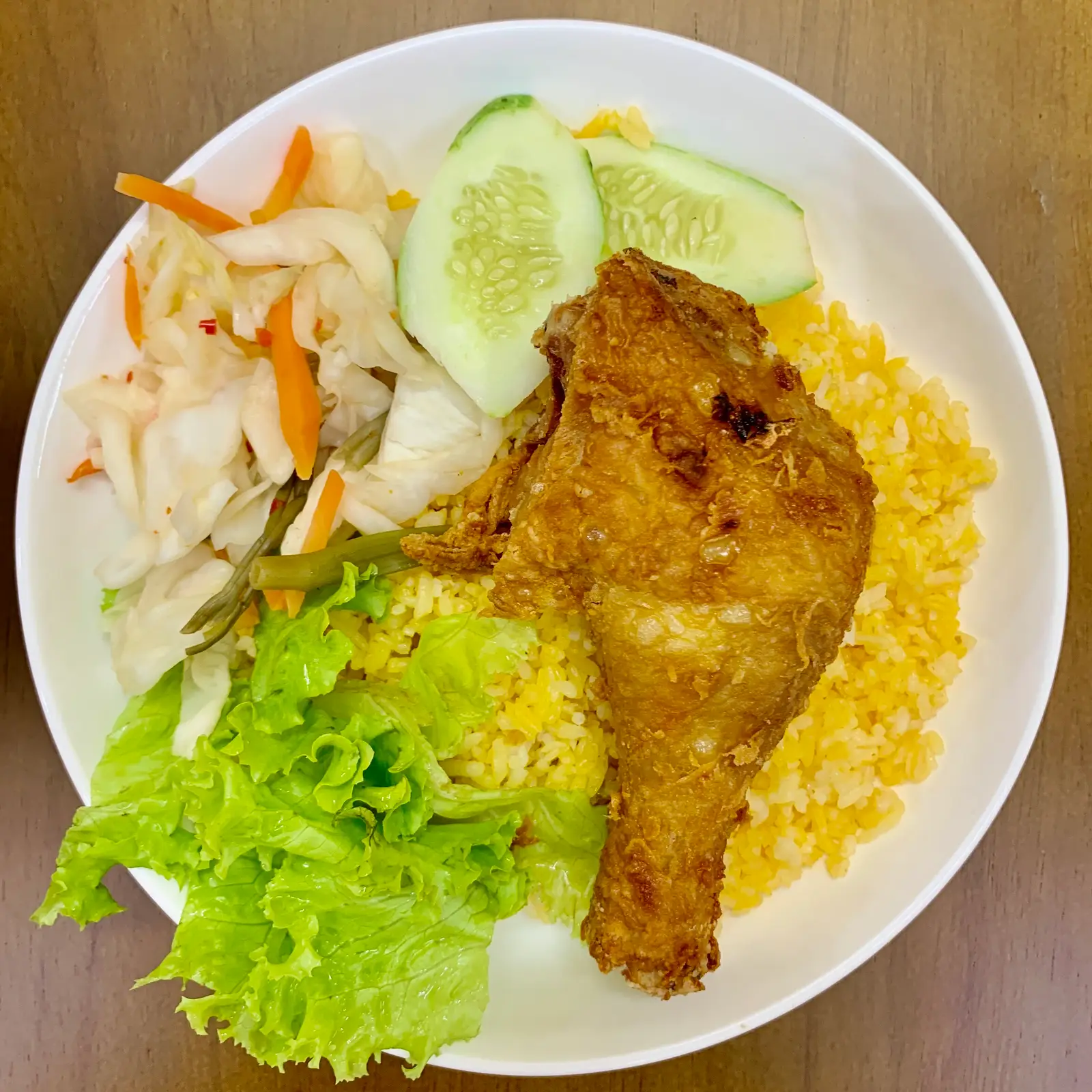 Hình ảnh CƠM ĐÙI GÀ giòn sốt bơ tỏi