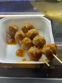 Hình ảnh Bò viên bi nướng sốt tomyum (4v)