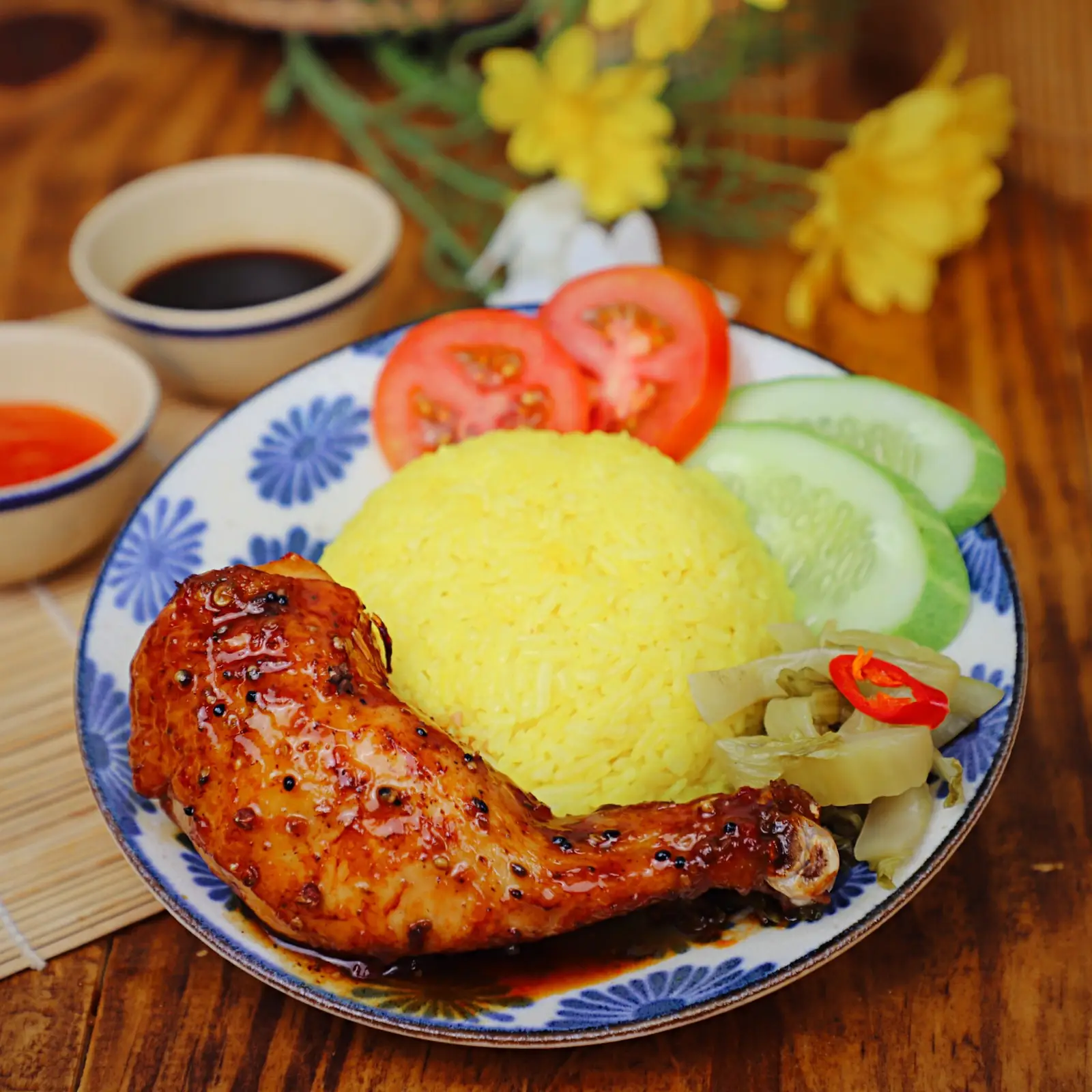 Hình ảnh Cơm Gà Xốt Mắc Khén (Đùi Tỏi/Má Đùi)