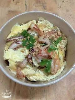 Hình ảnh Cơm Hải Sản Phủ Trứng 
