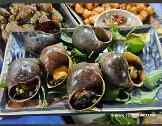 Hình ảnh Ốc bươu nướng tiêu xanh