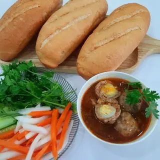 Hình ảnh Bánh mì chấm 3 viên xíu mại nhân trứng cút