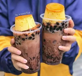Hình ảnh Trà sữa + trân châu đen mix bánh plan