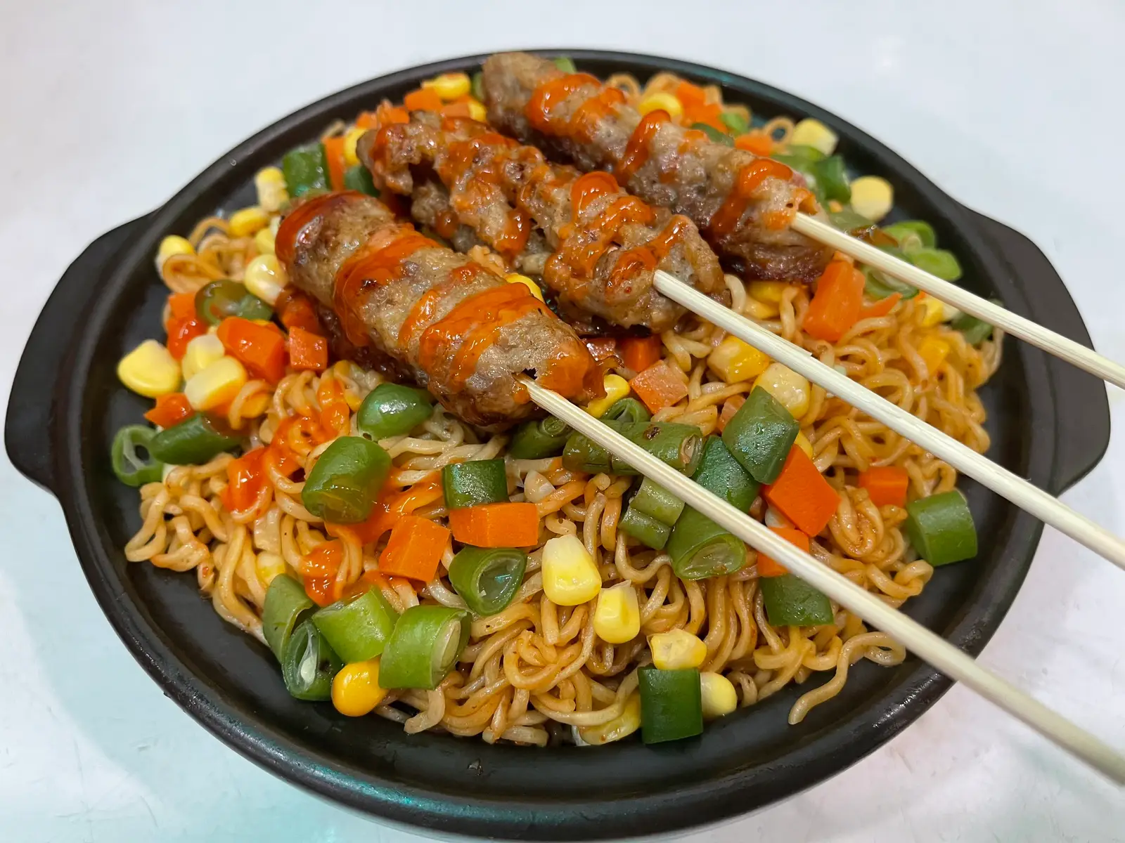 Hình ảnh 1 mỳ indomie trộn   4 que nem lụi +rau củ