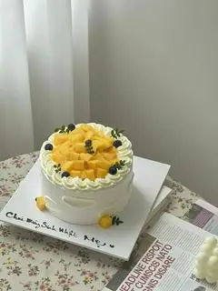 Hình ảnh Bánh kem xoài kín mặt