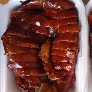 Hình ảnh Vịt quay da giòn - 1/2 con tặng 3 bánh bao,cải muối chua,dưa chuột,rau thơm nước chấm đầy đủ