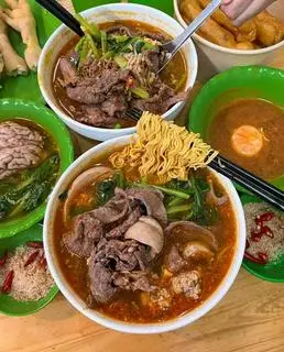 Hình ảnh Mì chua cay tim heo